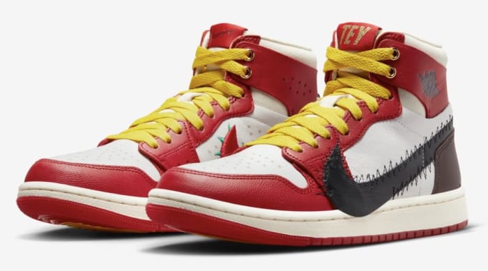 Side view of red, white, and black Air Jordan sneakers.